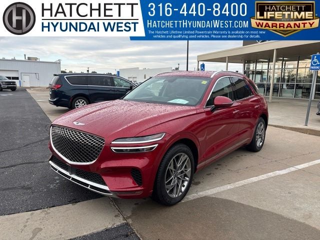 2025 Genesis GV70 2.5T in Mauna Red — front three-quarter view